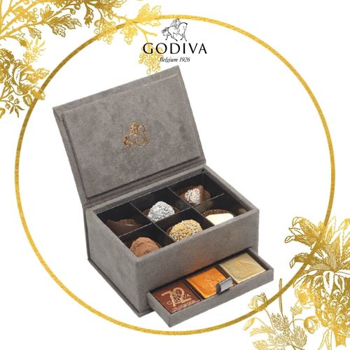 GODIVA CHOCOLATIER - Luxury Velvet Grey Box - Mini Velvet box - contains 18pcs chocolates, 6 assorted chocolates and 12 Godiva Carre. Small Velvet box - This box contains 30 different types of Godiva chocolates and 30 Carres Large Velvet box - This box contains 48 different types of Godiva chocolates and 70 Carres. Extra Large velvel box - This box contains 56 Assorted Godiva chocolates and 144 Godiva Carres.