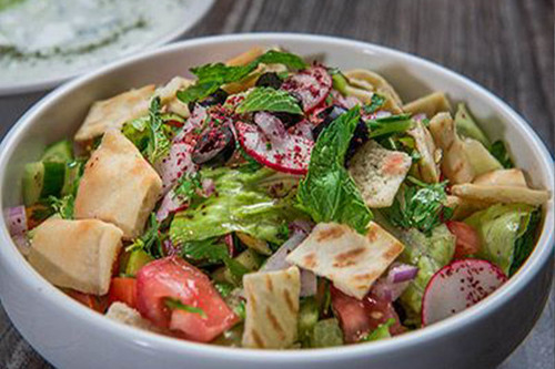 Fattoush - Fresh tomato, cucumber, lettuce, other vegetables and toasted
  bread with the famous fattoush sauce.