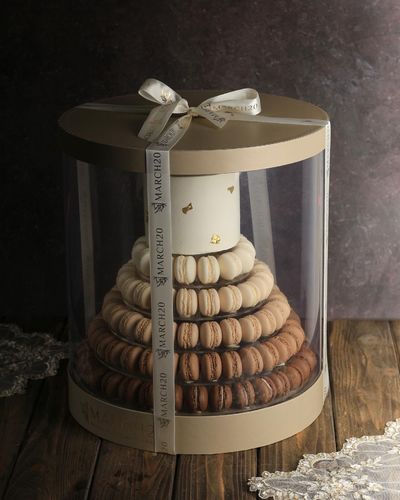 Macaron Pyramid - Consists of 120 macarons filled with mascarpone + cake filled with vanilla and chocolate Price: 27 KD