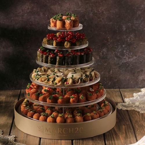 Salty Tower - Salty Tower A new and delicious assortment of citrus fruits Potato rolls, cream cheese rolls, grape leaves, cream cheese kibbeh, cheddar potatoes) 180 pieces, price 25