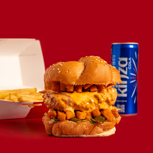 Zangori Meal - Ignite your taste buds with our Zangoori sandwich. A crispy sesame bun encases a juicy chicken breast smothered in our fiery dynamite sauce, layered with fresh lettuce, melted cheese, and topped with a fiery kick of peri peri hot fries.