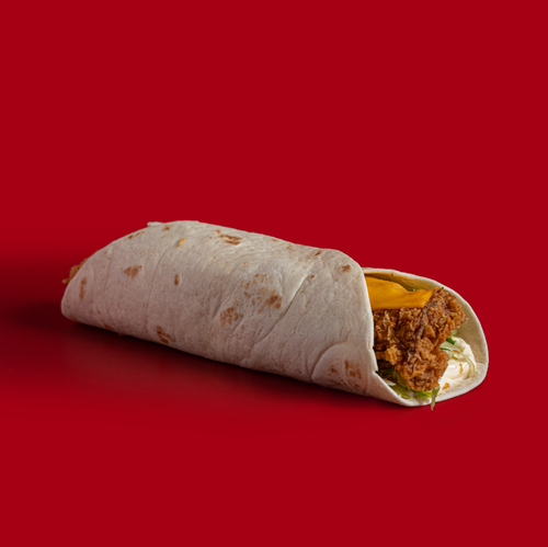 Chicken Tortilla - Juicy chicken tenders, your choice of mayo or hot sauce, and crisp lettuce are wrapped in a soft, pliable tortilla and topped with melted cheese for a satisfying and delicious bite.