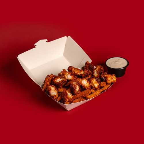 Nashville Fries - A tasty combination of Spiced Fries and hot
  nashville style popcorn chicken with ranch sauce.