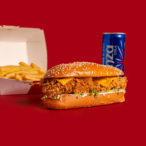 Super Fillet Meal - Experience a flavorful feast with our Super Fillet sandwich. A crispy chicken breast, creamy mayo or fiery hot sauce, and fresh lettuce are layered between a long, French potato bun with sesame seeds, topped with melted cheese for a delicious and filling bite.