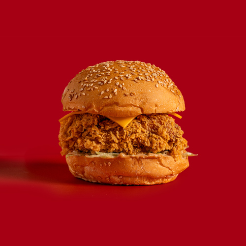 The Smokey - This sandwich consists of brioche bread, crispy chicken breast, distinctive smoky sauce, lettuce, and cheese.