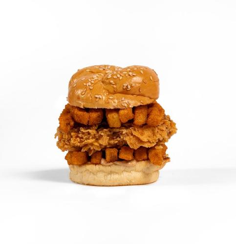 Mini Bulldozer - Supreme sesame bun, fries with spices, smoky sauce, crispy chicken breast, lettuce, and cheese.