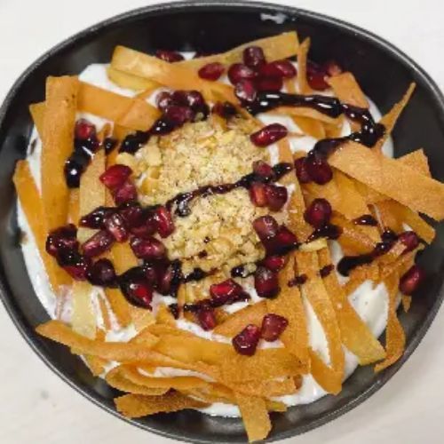 Levant - Vine Leave Fatteh - Vine leaves covered in special yogurt sauce and garnished with crunchy bread, walnuts and pomegranate