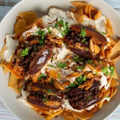 Makdous Fatteh - Middle Eastern dish, eggplants ,minced meat , Olive oil, tomatoes, onion, garlic, Pita bread, Pine nuts and Yogurt Sauce