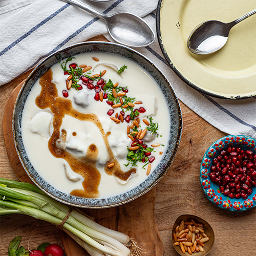 Tatar Barak - Our own recipe of meat dumplings dipped in yogurt sauce garnished with nuts.