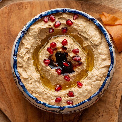 Mutabal - Eggplant blended with tahini, pomegranate molasses and served with your choice of bread.