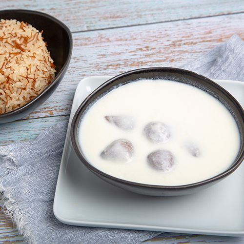 Kibbeh Labaniya - Kibbeh Stuffed With Meat Cooked In Yogurt Served With Vermicelli Rice