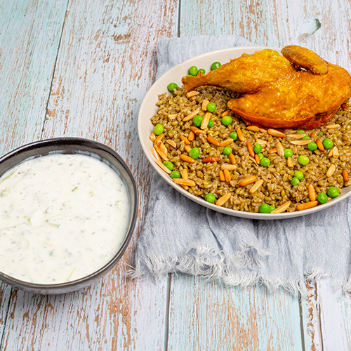 Chicken Freekeh - Freekeh cooked with chicken in nuts, served with cucumbers yogurt salad.