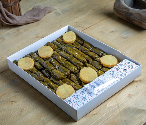 Yalanji Box - Grape leaves stuffed with rice, tomatoes and parsley simmered in lemon water and olive oil. (75 pcs)