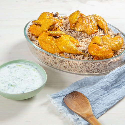 Middle Eastern Rice With Chicken Gathering - Rice mixed with minced beef, spices, topped with nuts, served with chicken and cucumber yogurt salad  Enough for 6 people