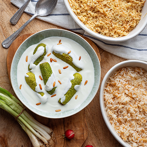 Sheikh El Mahshi (Kosa bl laban) - Meat stuffed zuchinni cooked in yogurt served with your choice of: