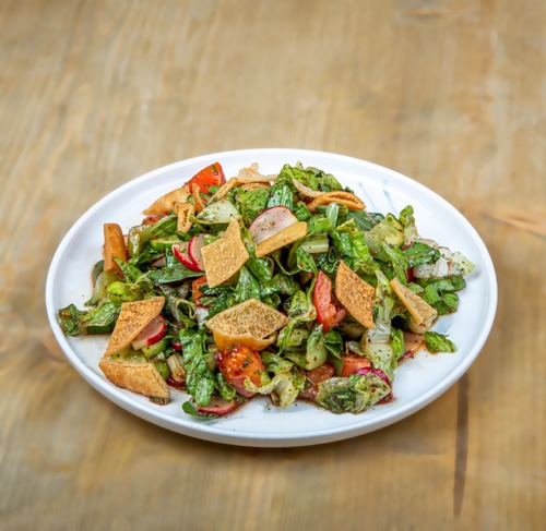 Fattoush - Lettuce , cucumber , tomatoes , radish, purslane, spring onion  topped with toasted bread and sumac