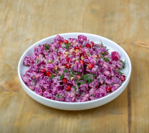 Beetroot Salad - Beetroot and dill topped with pomegranate and walnut mixed in a a light tahini dressing