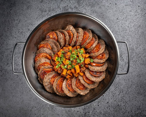 Baked meat tray with tomatoes gathering - Baked minced meat served with spicy potato cubes vermacelli rice and tahini sauce in a chafing dish collected the following day