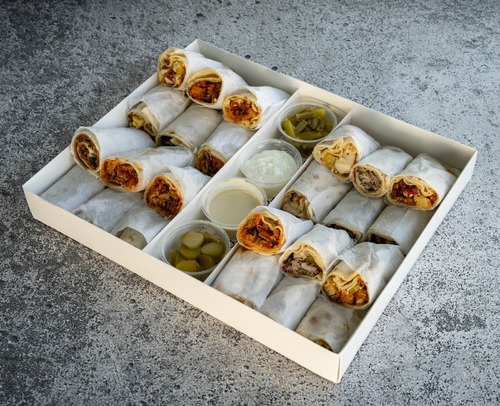Sandwich Box - 24 sandwich pieces from our selection served with pickles , Tahini and garlic sauce
