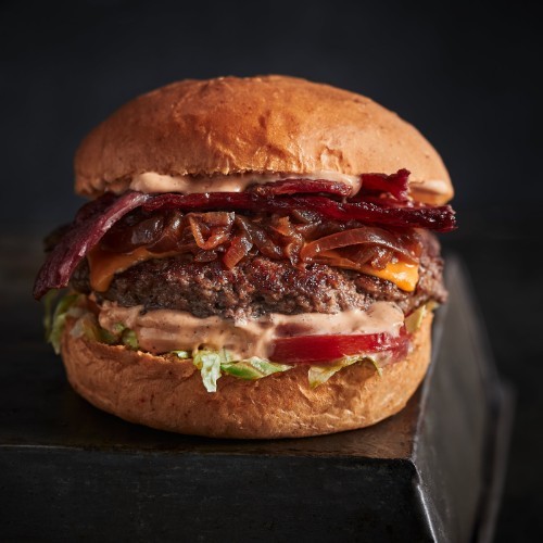 Shoreditch Burger - Beef patty, bacon, cheddar cheese, lettuce, tomato, caramelized Onion, shoreditch sauce