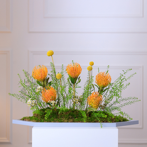 Mellow Yellow - Grey hexagon tray arranged with beautiful flowers    
 Height: 60cm - Width: 30cm