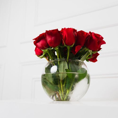 Red Roses - A glass vase that contains red roses.   Hight:    Width: