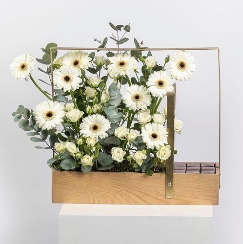 All White Stand - This white stand contains with our beautiful gerbera flowers and baby roses and 18 piece of chocolate.