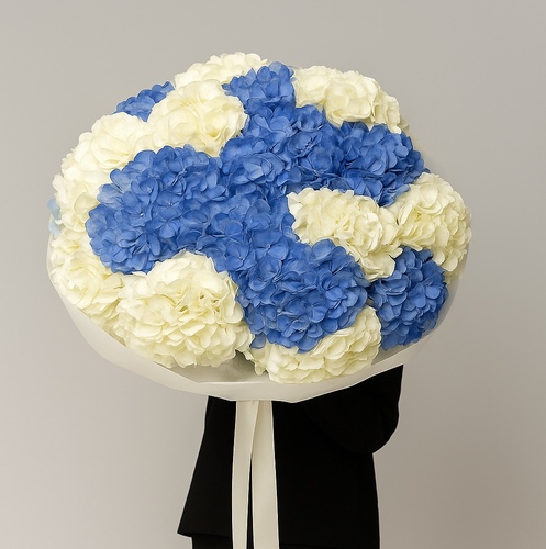 Clouds - A luxurious hand-tied bouquet of 15 blue and white hydrangeas, elegantly wrapped for a statement piece.
