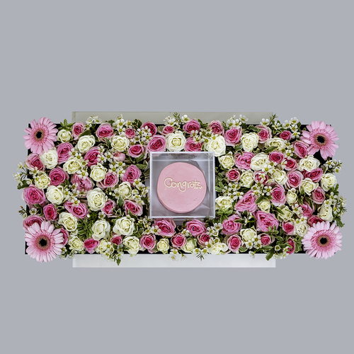 Pink tray - This beautiful tray contains gerbera flower and pink and white roses and a mini cake.