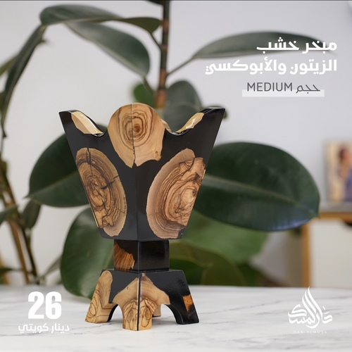 دسمان يونيك أسود - Made of olive wood and epoxy.