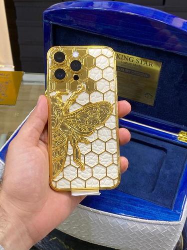 14 Pro device plated with 24 carat gold **