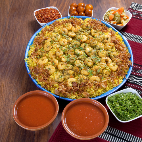 Murabian Tray - Basmati rice with spices and soft shrimp served with Dukes broth, red mabog, green mabog, Agar and Luqaimat