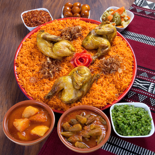 Chicken Kabsa Tray - Basmati rice with tomato sauce, spices, and Chicken chops with hasho served with broth, red mabog, green mabog and Luqaimat