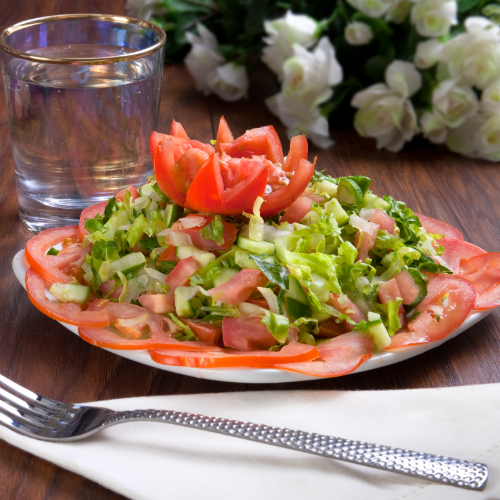 Green Salad - cucumber, tomatoes and fresh lettuce with olive oil and lemon