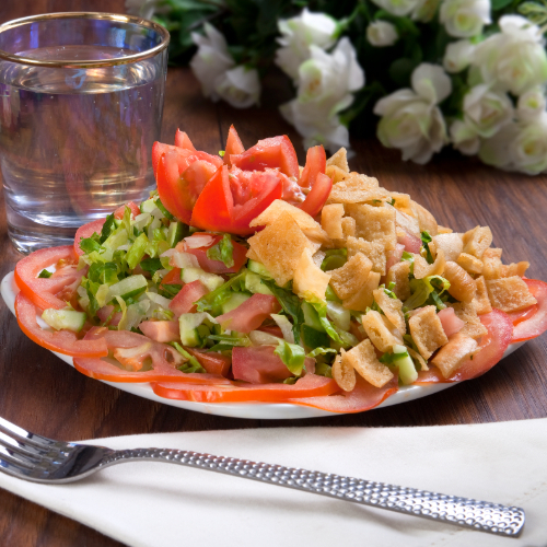 Fattoush Salad - cucumber, tomatoes, fresh lettuce with tasty Fattoush bread and light olive oil