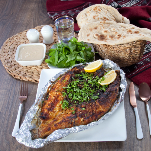 Grilled Sea Bass - Served with tahini, bread and rocca it needs 90 minutes to be prepared.