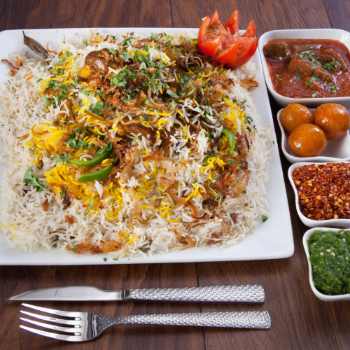 Arabic Meat Biryani - Basmati rice with meat and spices served with broth, red mabog, green mabog and luqaimat.