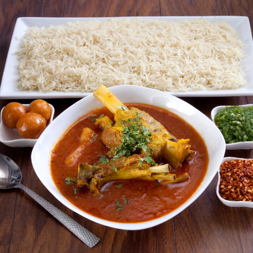 ِArabic Meat Marag - Arabian meat prepared with tomato sauce and spices served with white rice, red mabog, green mabog, agar and luqaimat.