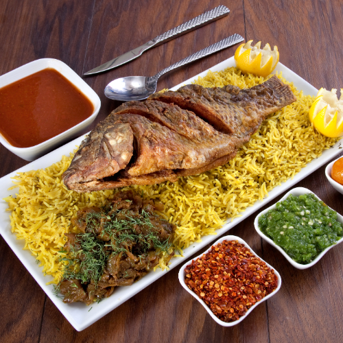 Mutabaq Tilapia - Basmati rice with Tilapia fish served with Dukes broth, red mabog, green mabog, Agar and Luqaimat