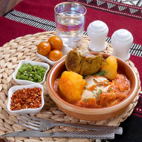 Tashreeb Meat - Rokak bread with Meat chops and pata broth served with red mabog, green mabog, Agar and Luqaimat