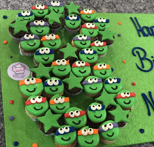 Ninja Turtles number with chocolate - 3 Dozen mini cupcakes Please keep your writing that you want on the board in the box belowThis Design with Chocolate Flavor and all the chocolate Flavor comes with nuts