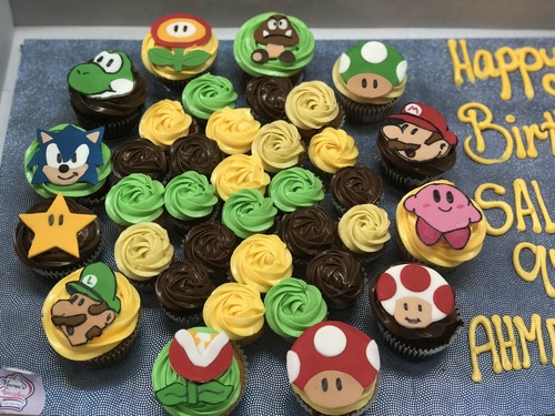 Super Mario & Friends - Big Cupcakes + mini Cupcakes Please keep your writing that you want on the board in the box belowThis Design with Chocolate Flavor and all the chocolate Flavor comes with nuts