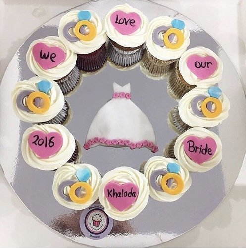 We love our bride - 1 Dozen big cupcakes Please keep your writing that you want on the hearts in the box below