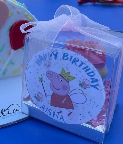 peppa pig giveaways - mini box minimum order 12 boxes size : 8cm white ribbon Light pink cream Please keep your writing that you want on the Sticker in the box below