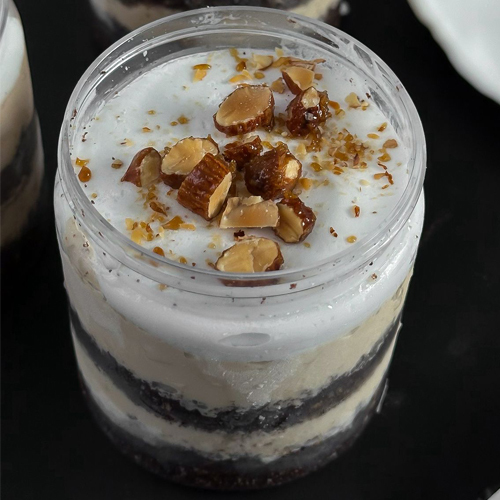 Spanish Latte Gelato Jar - Spanish Latte Gelato Jar A luxurious treat for coffee lovers! Enjoy the rich and creamy taste of Spanish Latte Gelato, layered with moist chocolate cake, topped with a light cream Chantilly foam, and finished with crunchy caramelized almonds. A unique flavor journey combining bold espresso, silky milk, and sweet nutty textures—all in one elegant jar.