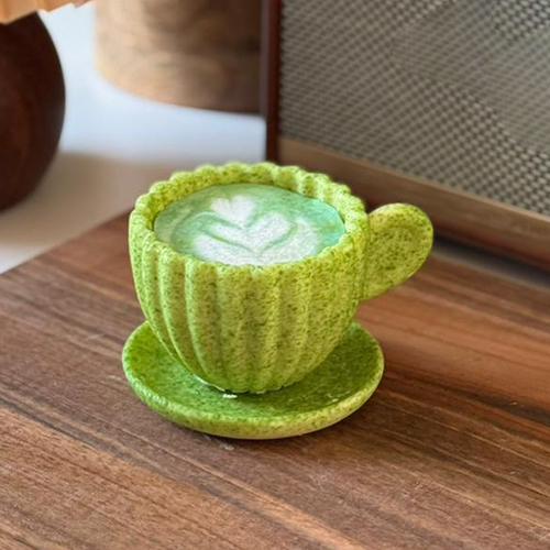 Matcha Latte - Matcha Latte A white chocolate cup filled with velvety matcha cream and light cake layers, crafted for a smooth and delightful flavor experience
