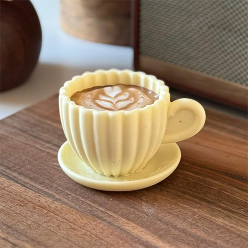 Vanilla Latte - Vanilla Latte A white chocolate cup filled with rich vanilla cream and moist coffee cake, finished with a soft latte art touch