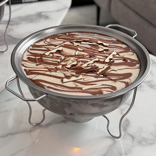 Hot Kinder Pudding (with Heater) - A warm indulgent pudding layered with soft moist cake, creamy Kinder filling, crunchy silky milk chocolate ganache, and luscious Kinder cream — comes with a heater to enjoy it perfectly warm.