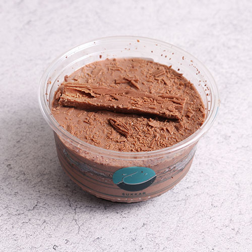 Flake - A rich layer of flakes mousse and chocolate brownies cake covered with flakes slices