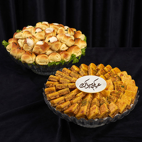 Mix Sukkar + Fatayer bowl - Mix Sukkar Bowl – 63 Pieces&nbsp;🌙🍫 A delightful assortment featuring&nbsp;three mixed flavors&nbsp;combined with:Oriental cheese and biscuits Pistachio nuts Dates Salted caramelPerfect for&nbsp;Eid gifting, family sharing, and festive treats. +Fatayer Bowl – 36 Pieces** 🥟🌙  A delicious assortment of **savory pastries** featuring:  * Pizza * Feta Cheese * Cream Cheese  Perfect for **Eid&nbsp; family gatherings, and festive occasions